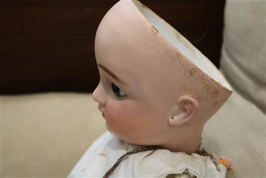 A late 19th century German bisque head doll 29in.